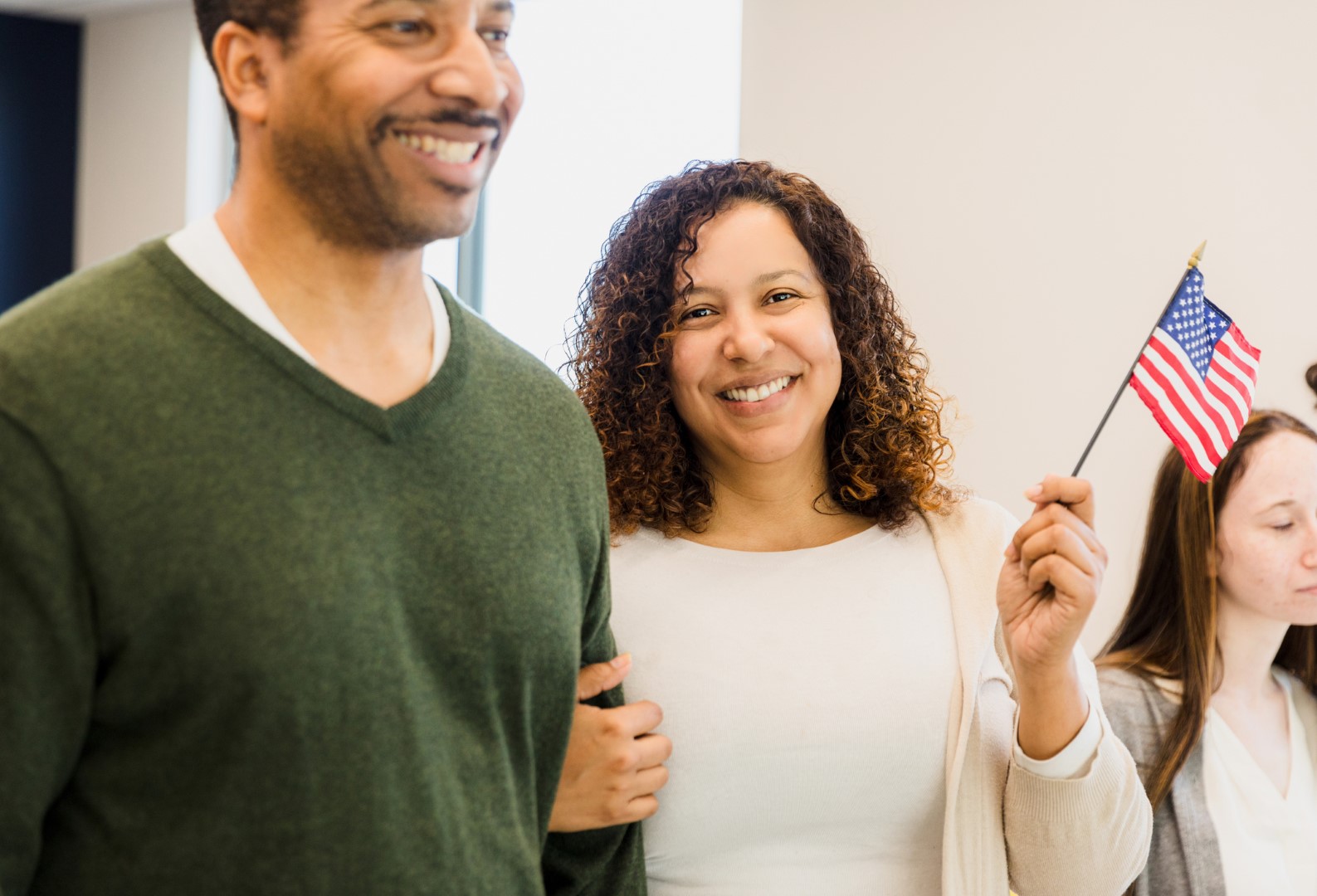 Happy Multiracial Couple Holding American Flag, Indoor Portrait | Call 918-505-4870